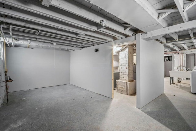 2116 W Atkinson Ave Unit 2116A, Milwaukee, WI 53209 - unfinished basement featuring a sink and washer / clothes dryer