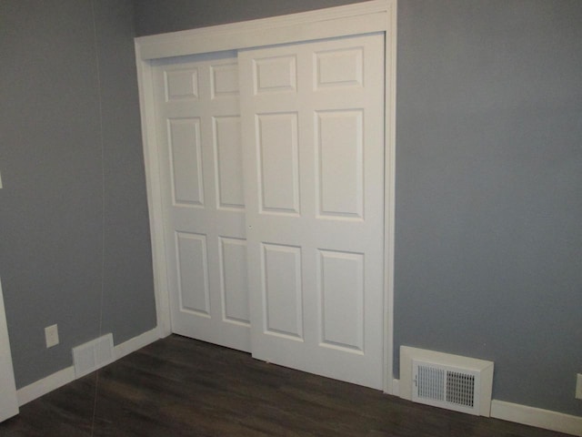 2116 W Atkinson Ave Unit 2116A, Milwaukee, WI 53209 - unfurnished bedroom featuring dark wood-style floors and a closet