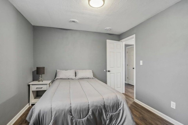 2116 W Atkinson Ave Unit 2116A, Milwaukee, WI 53209 - bedroom with dark wood finished floors and a textured ceiling