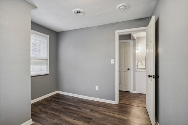 2116 W Atkinson Ave Unit 2116A, Milwaukee, WI 53209 - spare room featuring wood finished floors and a smoke detector