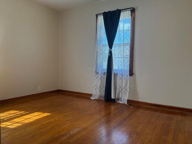 3681 S 5th St, Milwaukee, WI 53207 - spare room featuring wood finished floors