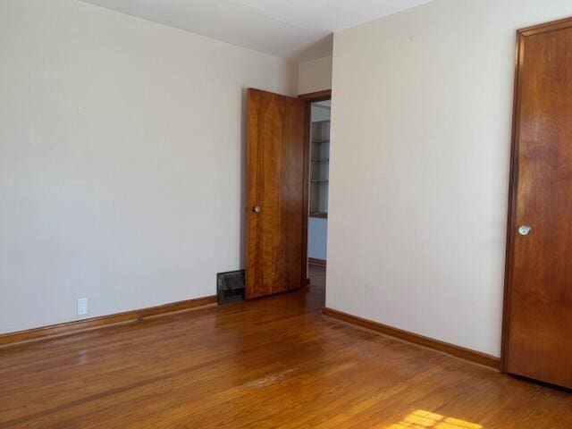 3681 S 5th St, Milwaukee, WI 53207 - empty room with wood finished floors and baseboards