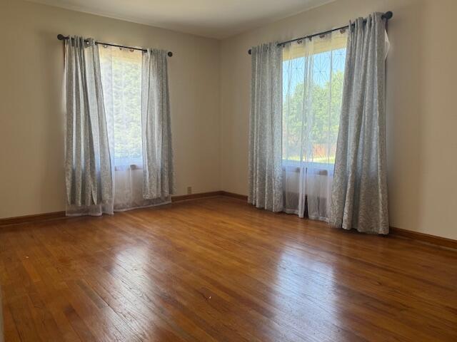 3681 S 5th St, Milwaukee, WI 53207 - empty room with wood finished floors and baseboards