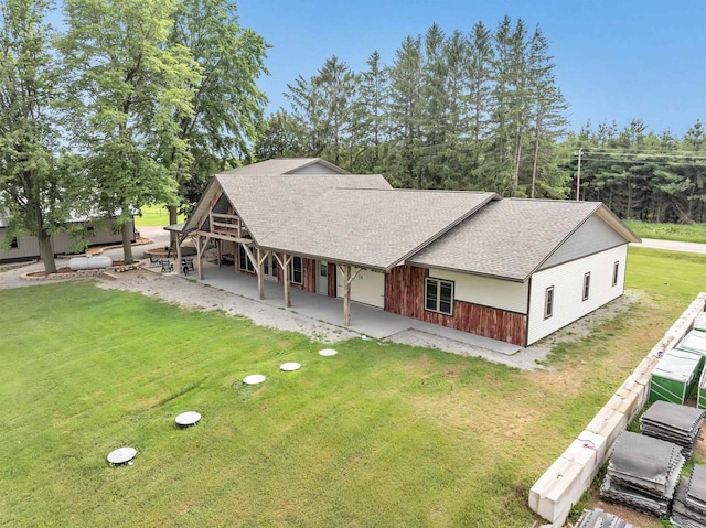 5836 County Road V, Gillett, WI 54124 - view of front of property featuring a front yard, roof with shingles, a patio, and covered porch