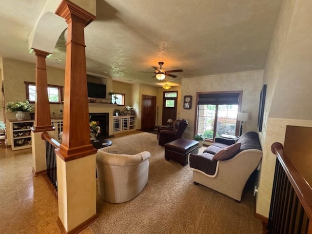 4920 N Meade St, Appleton, WI 54913 - living area featuring a fireplace, ornate columns, and ceiling fan