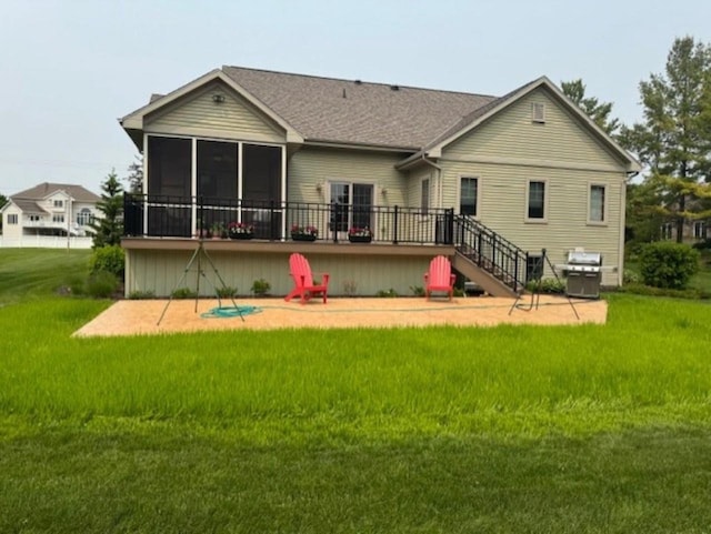 4920 N Meade St, Appleton, WI 54913 - rear view of property with a sunroom, a lawn, a wooden deck, a patio area, and a shingled roof