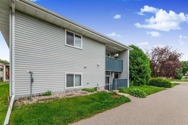 521 Seminole Way, Deforest, WI 53532 - rear view of property with a lawn and a balcony