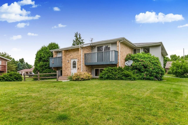 521 Seminole Way, Deforest, WI 53532 - rear view of house featuring a balcony and brick siding