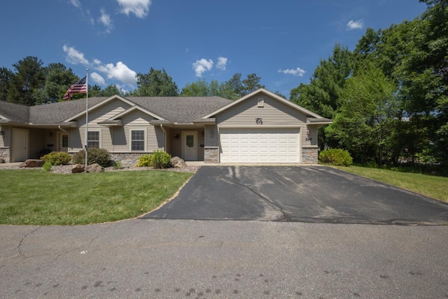 135 E Charles St, Schofield, WI 54476 - ranch-style house with stone siding, a garage, asphalt driveway, and a front lawn
