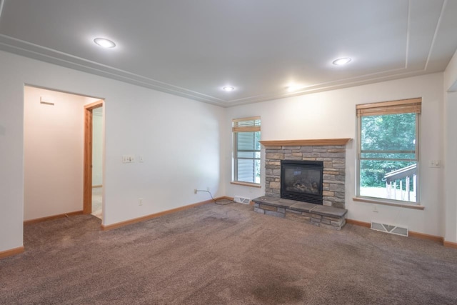 135 E Charles St, Schofield, WI 54476 - unfurnished living room with carpet flooring, healthy amount of natural light, and a fireplace