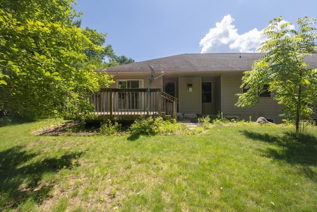 135 E Charles St, Schofield, WI 54476 - back of house featuring a lawn and a wooden deck