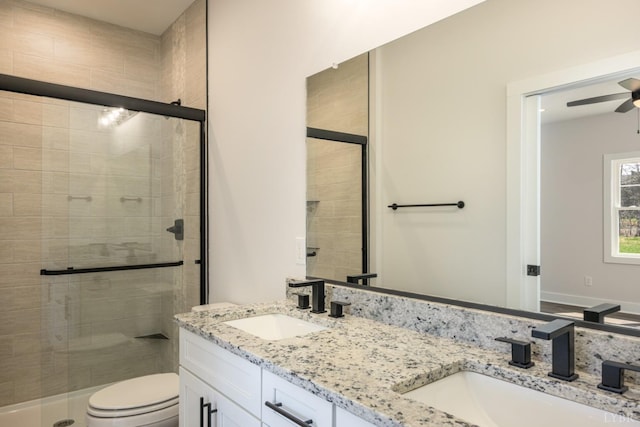 119 Lockridge Ln, Lynchburg, VA 24502 - full bathroom featuring double vanity, a stall shower, toilet, and a ceiling fan