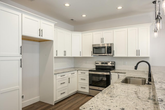 119 Lockridge Ln, Lynchburg, VA 24502 - kitchen with appliances with stainless steel finishes, a sink, dark wood-style flooring, white cabinetry, and recessed lighting