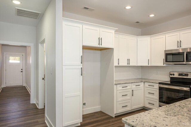 119 Lockridge Ln, Lynchburg, VA 24502 - kitchen featuring stainless steel appliances, dark wood-style flooring, baseboards, backsplash, and white cabinetry