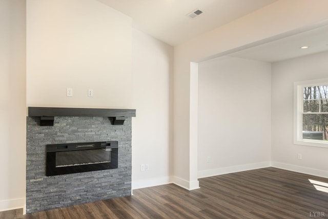 119 Lockridge Ln, Lynchburg, VA 24502 - unfurnished living room with dark wood-style flooring, baseboards, and a stone fireplace