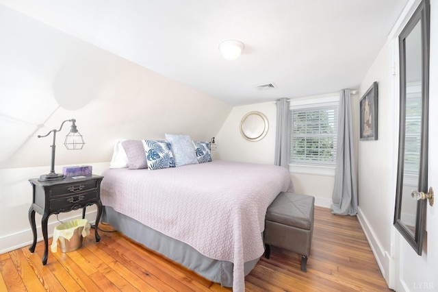 7505 Timberlake Rd, Lynchburg, VA 24502 - bedroom featuring wood finished floors, lofted ceiling, and baseboards