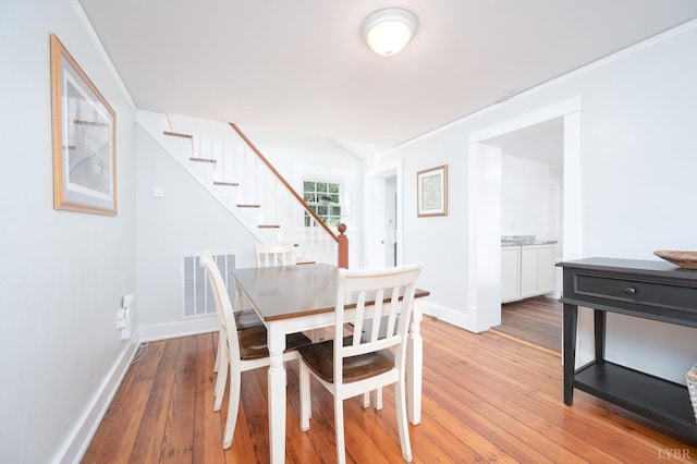 7505 Timberlake Rd, Lynchburg, VA 24502 - dining area featuring stairs, light wood finished floors, and baseboards