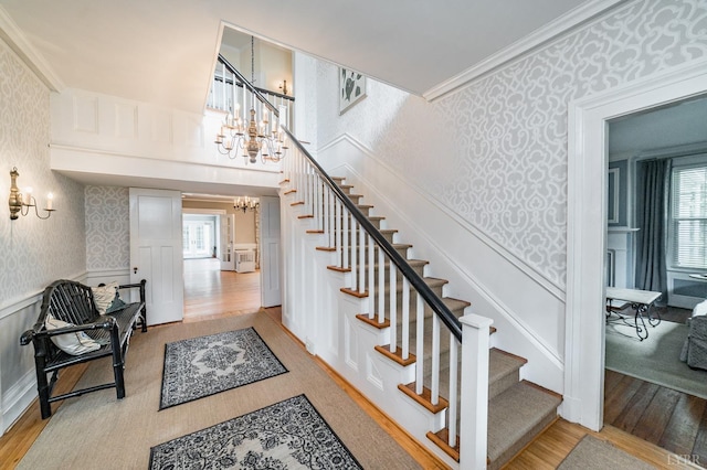7821 Bellevue Rd, Forest, VA 24551 - stairway featuring hardwood / wood-style flooring, ornamental molding, and a wealth of natural light