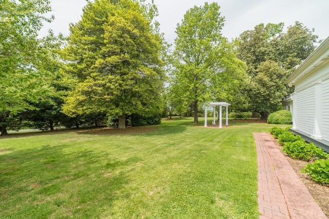 7821 Bellevue Rd, Forest, VA 24551 - view of grassy yard with a pergola