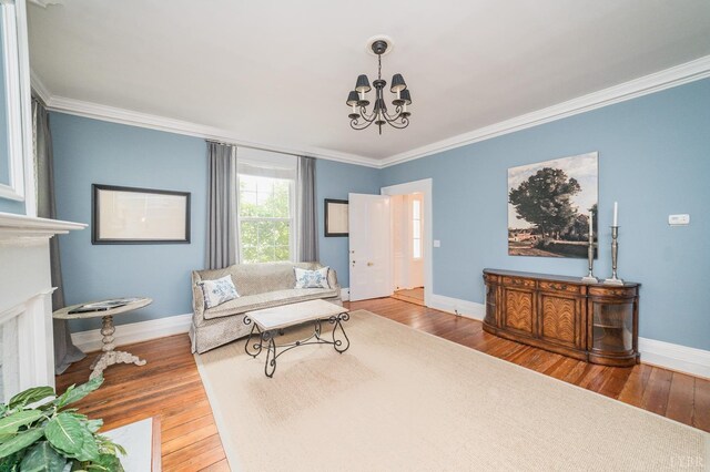 7821 Bellevue Rd, Forest, VA 24551 - living area featuring a chandelier, crown molding, baseboards, and wood finished floors