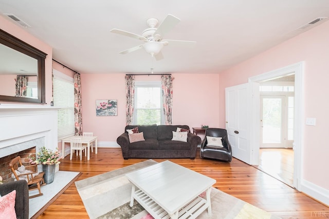 7821 Bellevue Rd, Forest, VA 24551 - living room featuring wood-type flooring, ceiling fan, and a premium fireplace