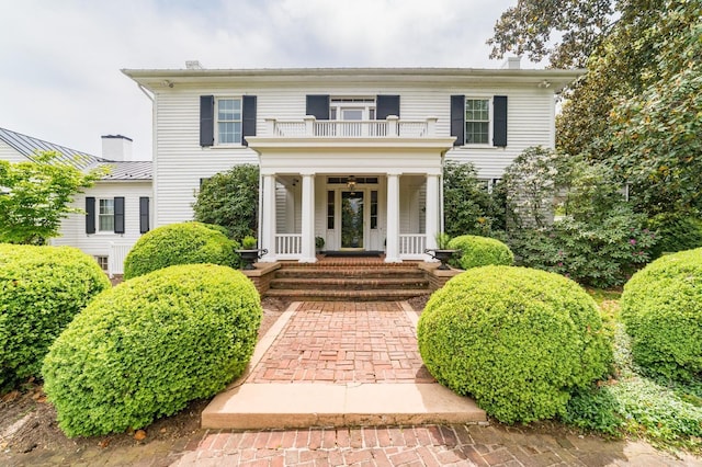 view of front of home with a balcony