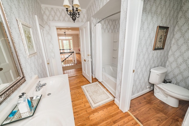 7821 Bellevue Rd, Forest, VA 24551 - full bathroom with a chandelier, wood-type flooring, wallpapered walls, toilet, and vanity