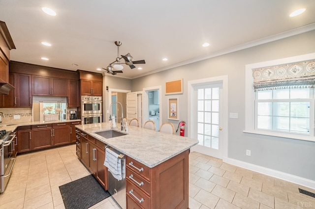 7821 Bellevue Rd, Forest, VA 24551 - kitchen featuring backsplash, sink, ceiling fan, an island with sink, and stainless steel appliances