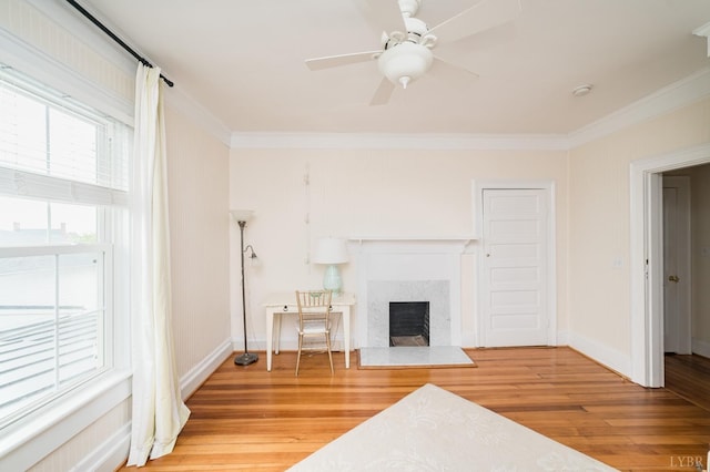 7821 Bellevue Rd, Forest, VA 24551 - living area featuring ornamental molding, light wood-style floors, a fireplace, baseboards, and ceiling fan
