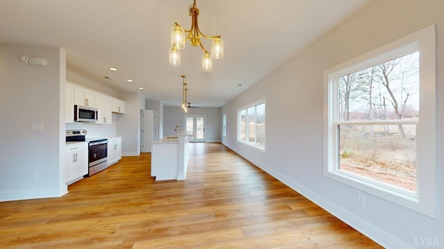 165 Allure Dr, Rustburg, VA 24588 - kitchen with white cabinetry, appliances with stainless steel finishes, pendant lighting, and light countertops