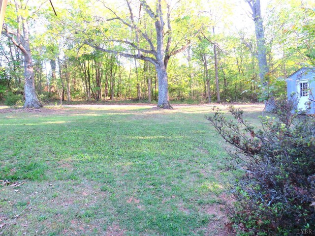 11420 Wards Rd, Rustburg, VA 24588 - view of grassy yard featuring a wooded view