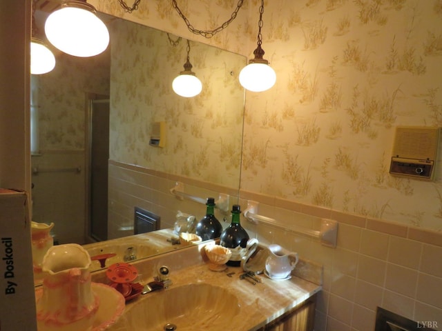 11420 Wards Rd, Rustburg, VA 24588 - bathroom featuring vanity, wallpapered walls, a shower stall, and a wainscoted wall