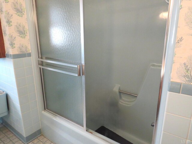 11420 Wards Rd, Rustburg, VA 24588 - full bathroom with wallpapered walls, a wainscoted wall, tile walls, and combined bath / shower with glass door