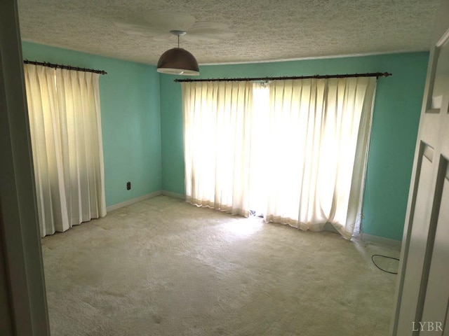 11420 Wards Rd, Rustburg, VA 24588 - empty room with carpet floors, a textured ceiling, and baseboards