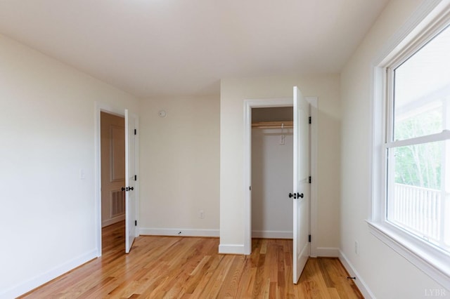 465 Soybean Dr, Appomattox, VA 24522 - unfurnished bedroom with light wood-style floors, baseboards, and a closet