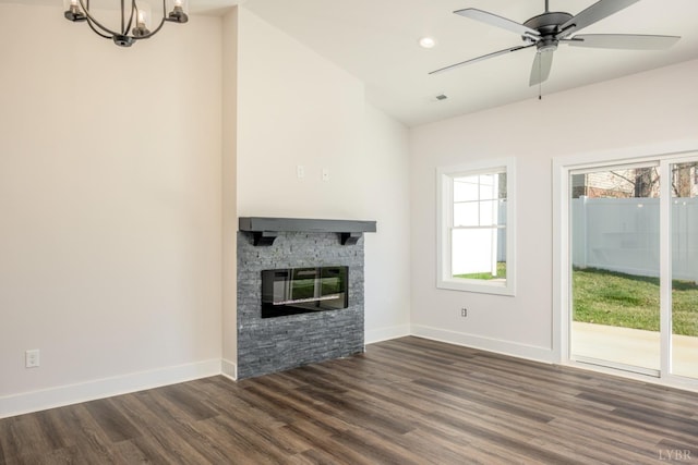 104 Lockridge Ln, Lynchburg, VA 24502 - unfurnished living room with dark wood-style flooring, a stone fireplace, a chandelier, baseboards, and recessed lighting