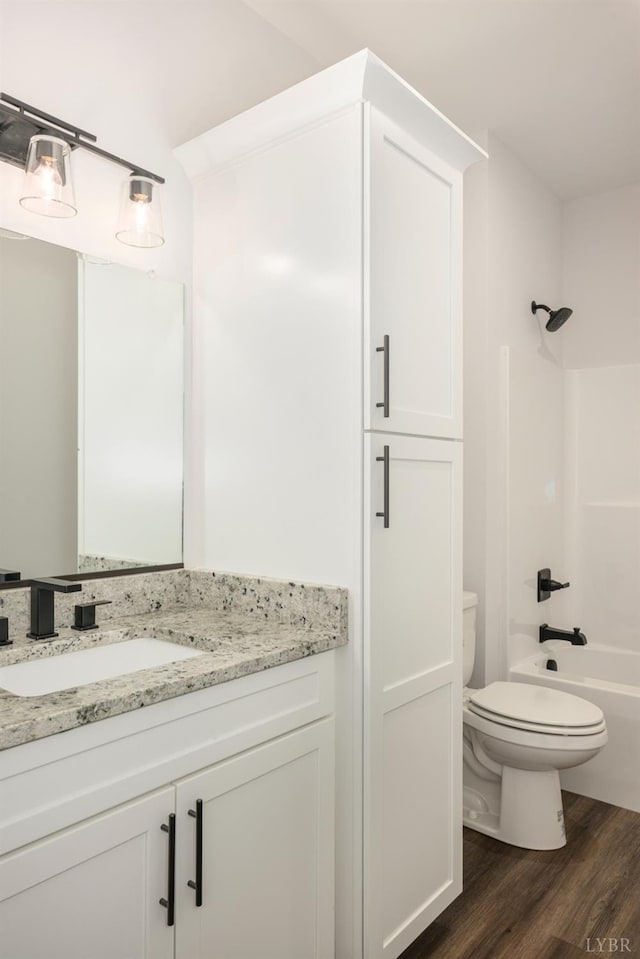 104 Lockridge Ln, Lynchburg, VA 24502 - full bathroom with wood finished floors, toilet, vanity, and bathtub / shower combination