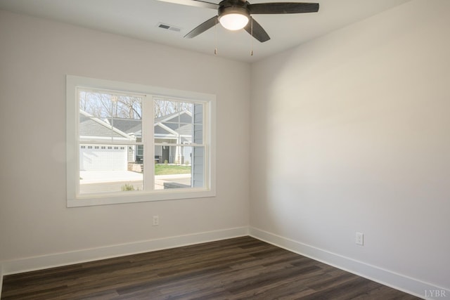 104 Lockridge Ln, Lynchburg, VA 24502 - spare room with baseboards, dark wood-type flooring, and a ceiling fan
