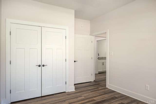104 Lockridge Ln, Lynchburg, VA 24502 - unfurnished bedroom featuring dark wood-type flooring, baseboards, and a closet