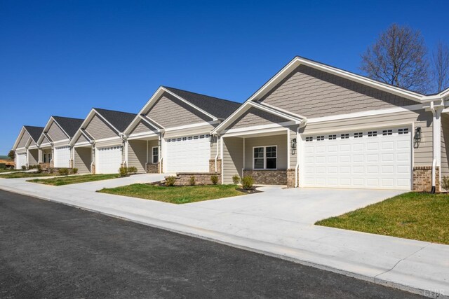 104 Lockridge Ln, Lynchburg, VA 24502 - craftsman-style home with concrete driveway, an attached garage, and brick siding