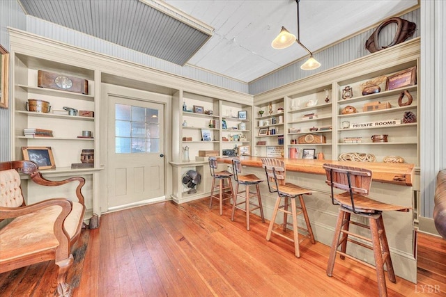 2816 Lowesville Rd, Lowesville, VA 22922 - home office featuring wood-type flooring, built in shelves, and built in study area