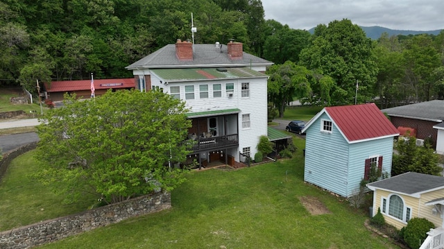 2816 Lowesville Rd, Lowesville, VA 22922 - back of property featuring a chimney, a lawn, and metal roof