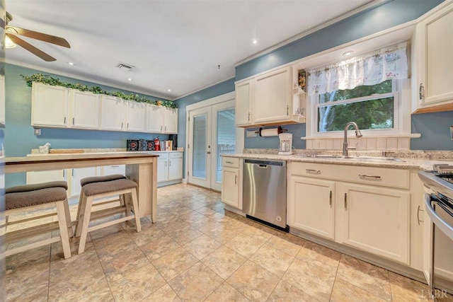 kitchen with light tile patterned floors, light stone countertops, dishwasher, ceiling fan, and sink