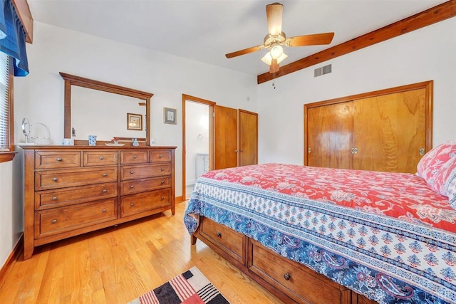 bedroom featuring ceiling fan, light hardwood / wood-style flooring, and a closet