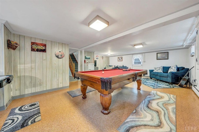 recreation room with wood walls and billiards
