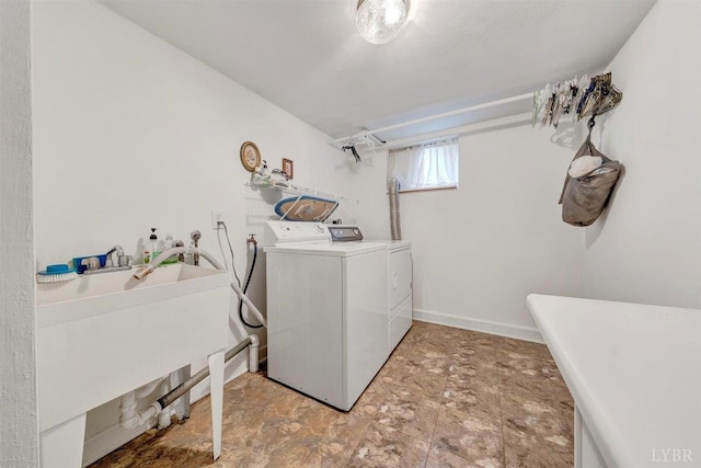 clothes washing area featuring light tile patterned floors and separate washer and dryer