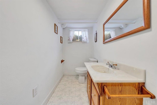 bathroom with vanity, toilet, and tile patterned flooring