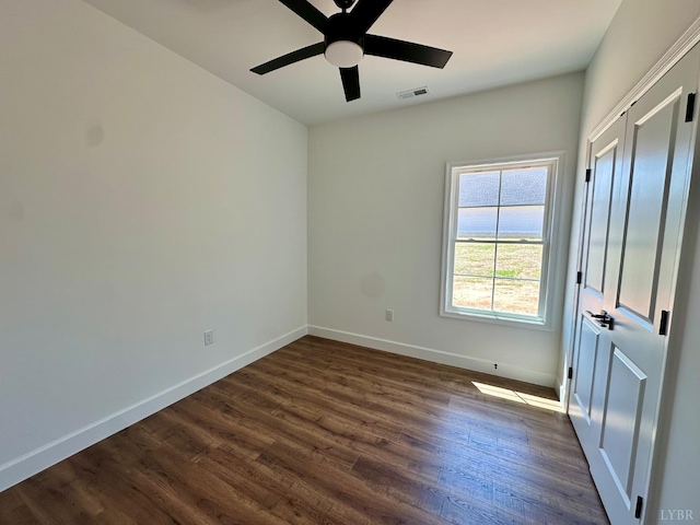 4678 Wildway Rd, Appomattox, VA 24522 - spare room featuring a ceiling fan, dark wood finished floors, and baseboards