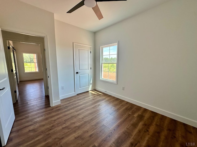 4678 Wildway Rd, Appomattox, VA 24522 - unfurnished bedroom featuring dark wood-style floors, baseboards, and a ceiling fan