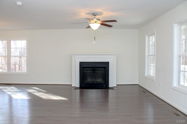 872 Two Bid Rd, Evington, VA 24550 - unfurnished living room with a wealth of natural light, visible vents, and wood finished floors